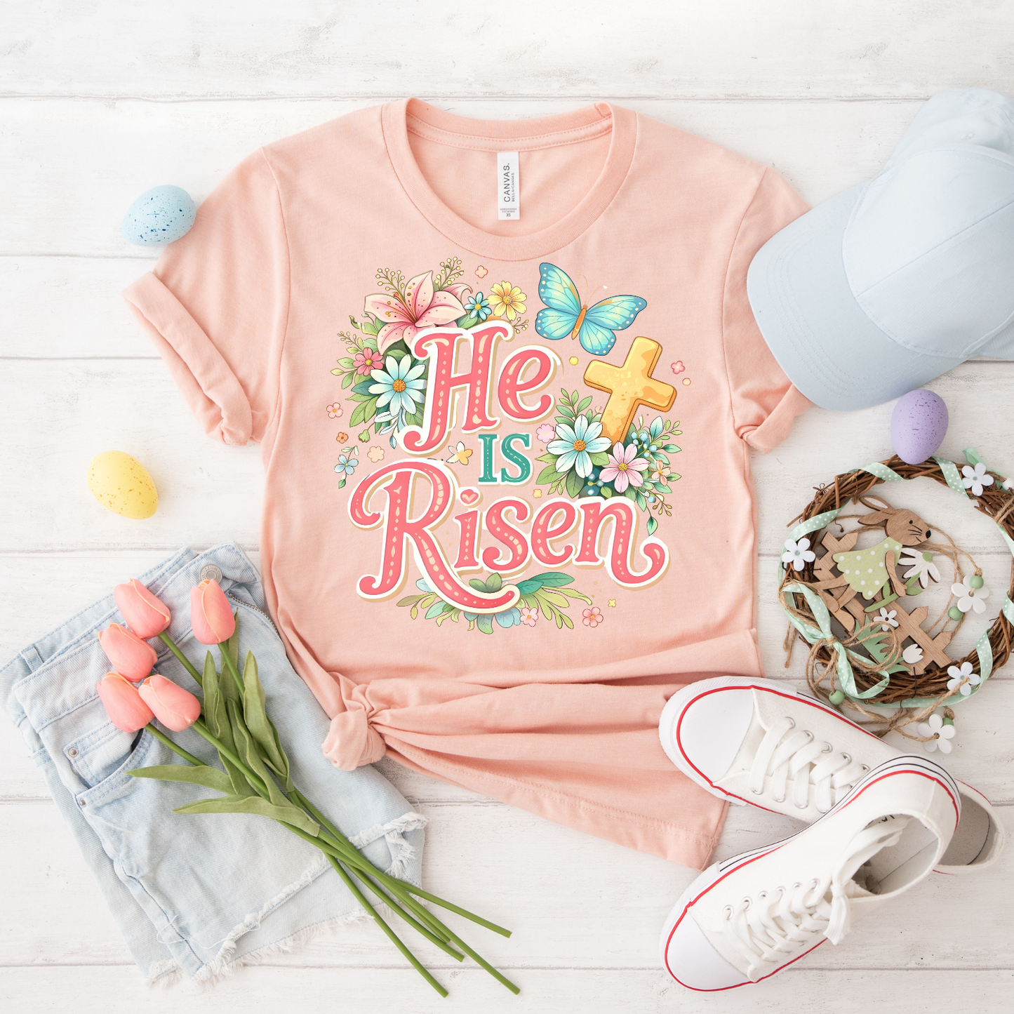 He Is Risen Floral Tee — Easter Christian T-Shirt with Cross & Butterfly